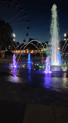Yevpatoriya park at night: fountains, lights, and the Ferris wheel