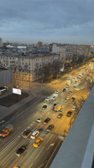 Woman takes mirror selfies in pink dress in Moscow
