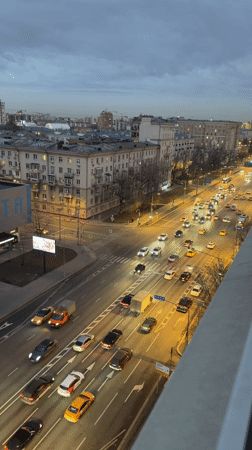 Woman takes mirror selfies in pink dress in Moscow