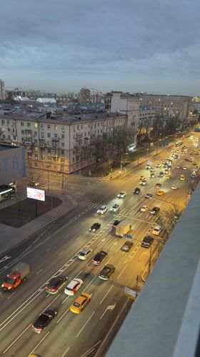Woman takes mirror selfies in pink dress in Moscow