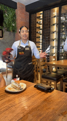 Restaurant staff perform tambourine celebration in Villa El Salvador
