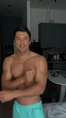 Moscow man poses shirtless in apartment during morning routine
