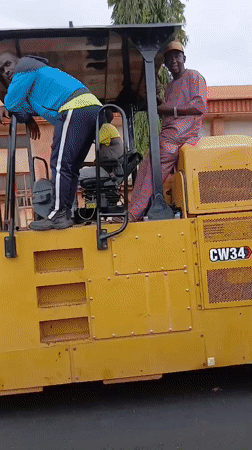 Road construction underway in Yelwa with crew on fresh asphalt