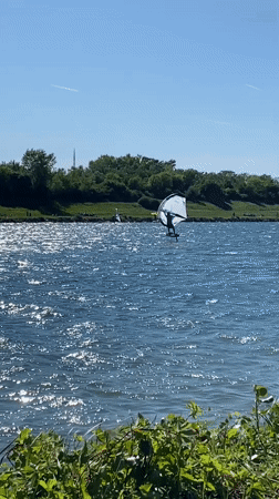 Windsurfer enjoys sunny afternoon on Vienna lake