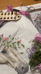 Craft enthusiast documents unicorn cross-stitch project in Yekaterinburg