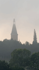 Misty evening captured around Da Lat tower and lakeside road