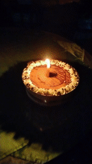 Nighttime outdoor dining celebration with cake in Tinaquillo, Venezuela