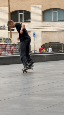 Skateboarders practice tricks at Barcelona's MACBA plaza