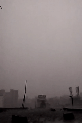 Heavy rain and fog shroud Dhaka cityscape