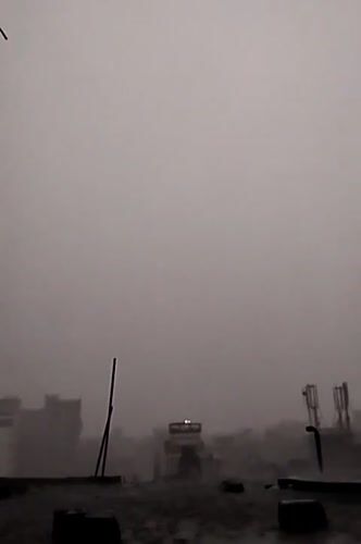 Heavy rain and fog shroud Dhaka cityscape