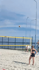 Beach volleyball game in full swing on a sunny day