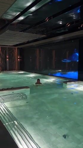 Man swims in luxury indoor pool in Bansko, Bulgaria