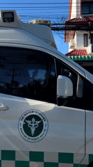 Ambulance, scooters spotted during morning traffic in Thai village