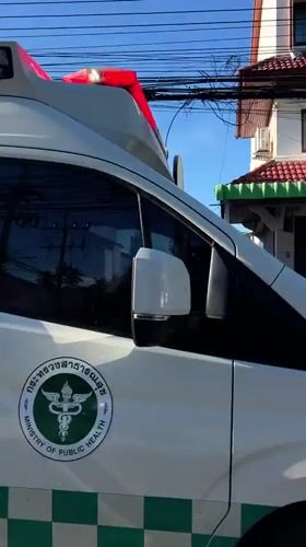 Ambulance, scooters spotted during morning traffic in Thai village