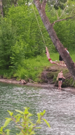 Rope swings and pedal boats on a sunny Abakan river day