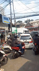 Busy midday traffic on a Cisarua street, captured from multiple angles