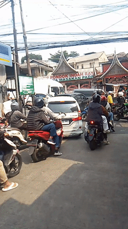 Busy midday traffic on a Cisarua street, captured from multiple angles