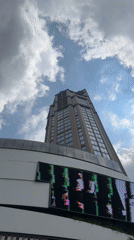 Street-level Bangkok: luxury storefronts, transit infrastructure, and traditional architecture