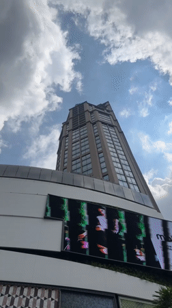 Street-level Bangkok: luxury storefronts, transit infrastructure, and traditional architecture
