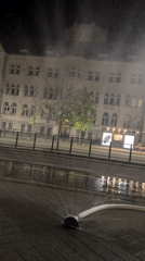 Fire hoses wet Poznań streets on a late summer night