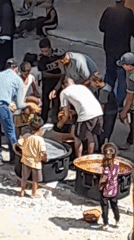 Food distribution draws crowds in Khan Yunis courtyard