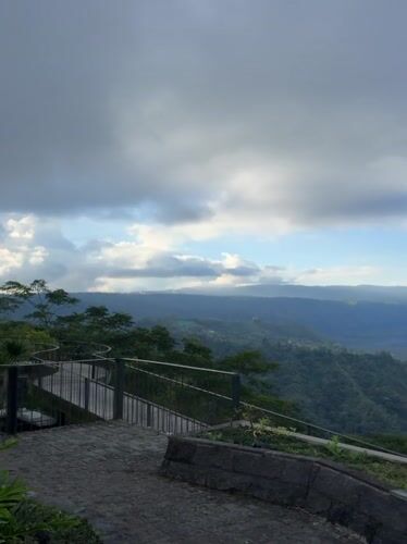 Tourist captures Mount Batur volcanic landscape views in Kintamani