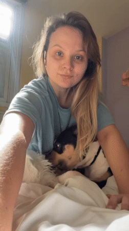Woman spends morning with two dogs in Tel Aviv apartment