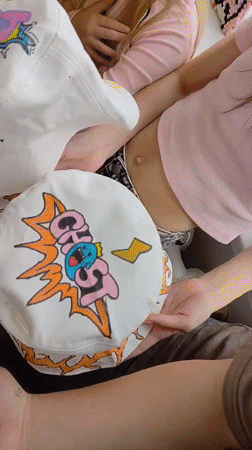 Custom-decorated bucket hats displayed by group in Markovskii, Russia
