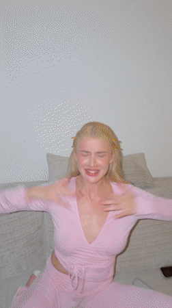 Two women dance and film selfie indoors in Serbia