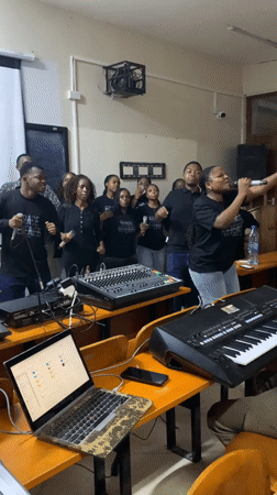 Music group rehearses with equipment in Dar es Salaam classroom