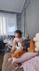 Child plays with stuffed animals collection in Kempelevo bedroom