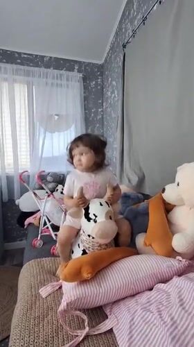 Child plays with stuffed animals collection in Kempelevo bedroom