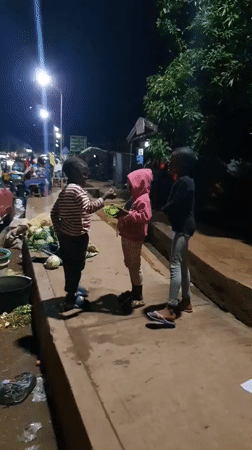 Evening street life unfolds in Bukuru, Nigeria market area