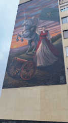 Spring blooms and urban murals captured during evening neighborhood walk