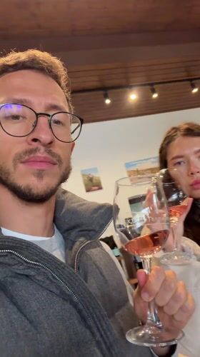 Couple shares rose wine in Omodos, Cyprus establishment