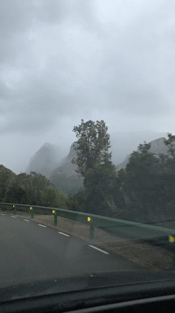 Car travels road near Esparreguera under overcast skies