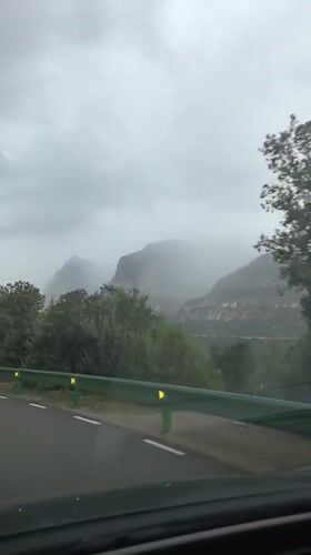Car travels road near Esparreguera under overcast skies