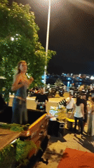 Nha Trang street party with fireworks, dancers, and pickup truck stages