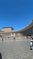 Morning crowds visit St. Peter's Square under clear skies