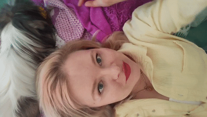 Woman poses for photos with pet dog in Izhevsk