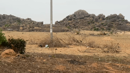 Rocky hills documented along dirt road in Kuru, Nigeria