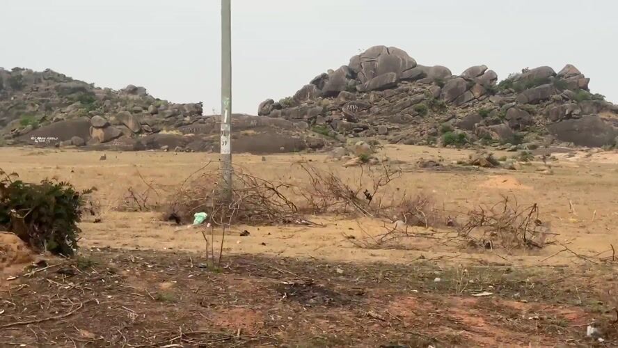 Rocky hills documented along dirt road in Kuru, Nigeria