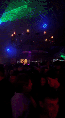 Nightclub crowd under colored lights in Sozopol