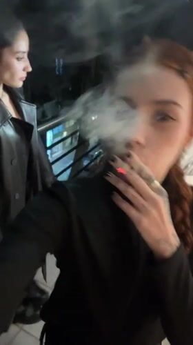 Late-night gathering documented in Buenos Aires with roses and smoking