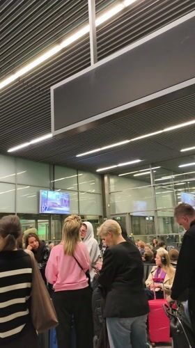 Busy early morning scene at Balice Airport departure area