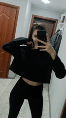 Woman Takes Mirror Selfies in Hallway