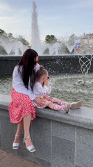 Woman and child spend afternoon at Chaikovsky fountain