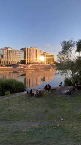 Quiet evening in a Kyiv riverside park at sunset