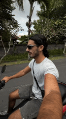 Man records while riding scooter in North Kuta early morning