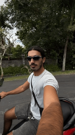 Man records while riding scooter in North Kuta early morning